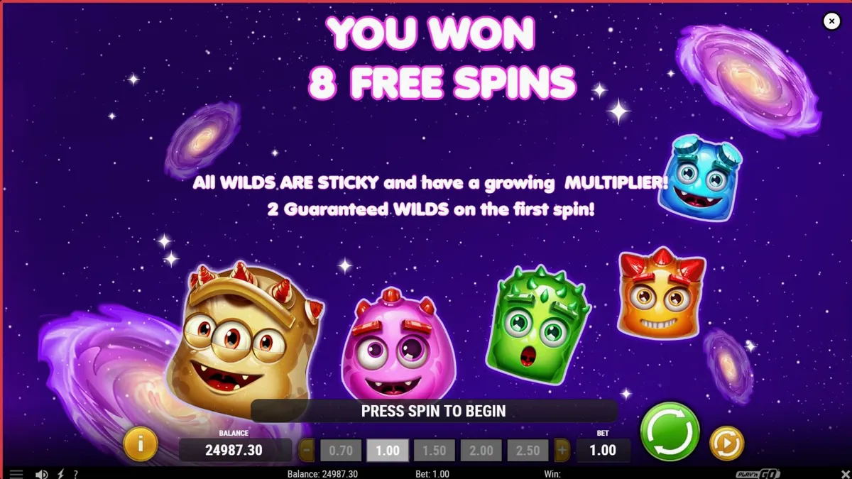 Tampilan visual slot Reactoonz Blitzways dengan latar belakang ruang angkasa yang gelap dan karakter alien berwarna-warni.